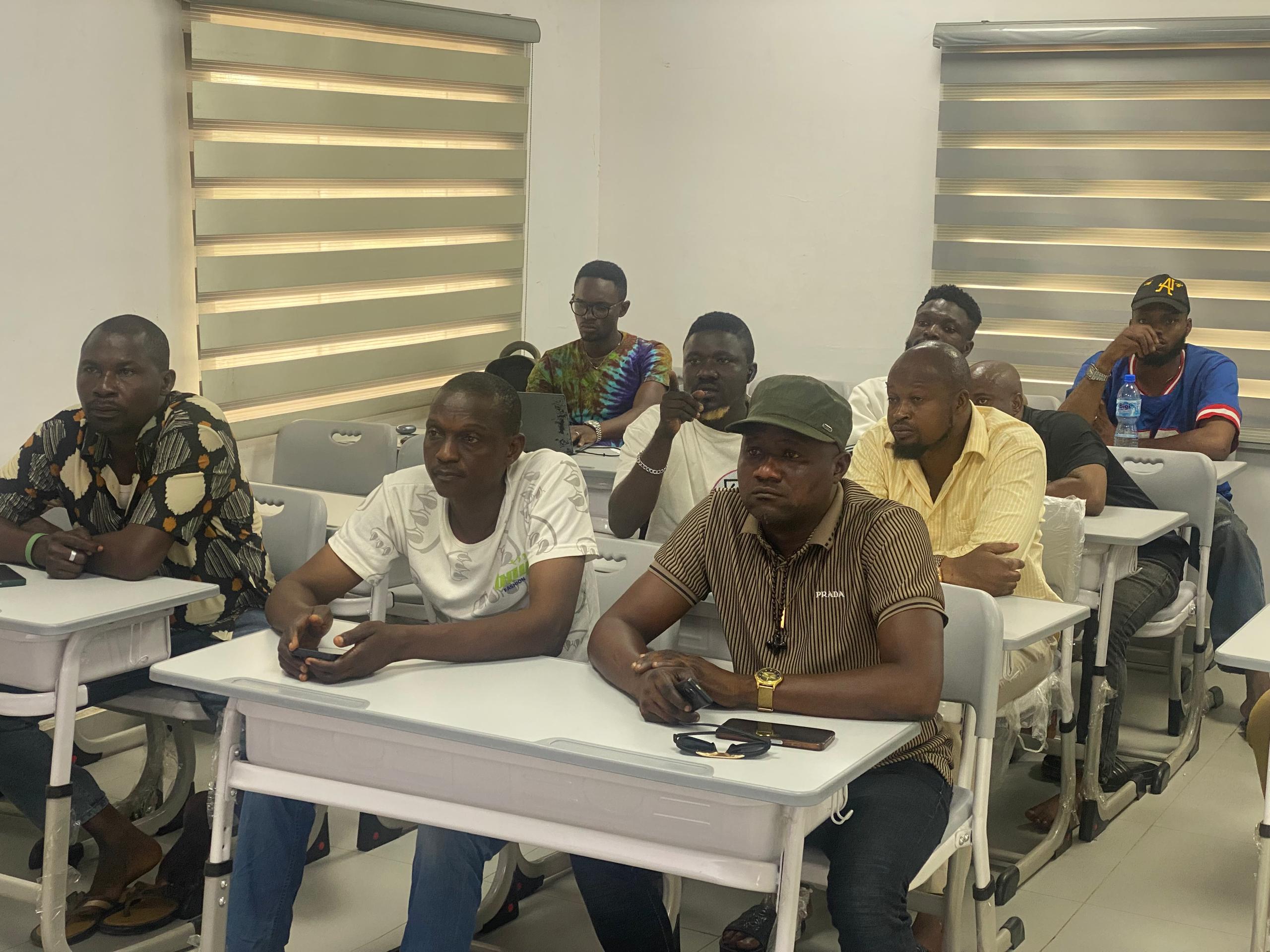 Automotive Students Reviewing Technical Training Certificate